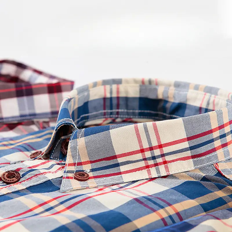 Men’s cotton plaid long sleeve slim fit shirt collar in blue red and cream with brown wooden buttons.