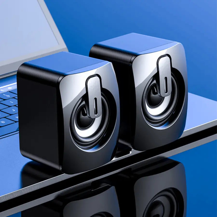 black and silver cube-shaped usb computer speakers with a glossy finish designed as a stereo desktop mini sound system