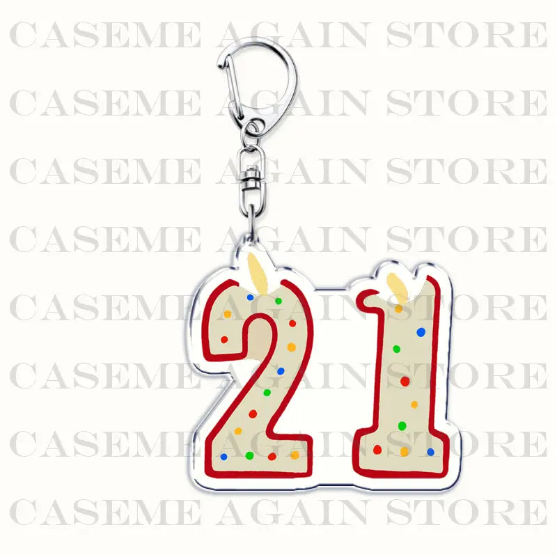 A shiny silver acrylic keychain featuring a colorful birthday candle shaped charm with the number 21 in red outline and multicolored sprinkles designed as a Gracie Abrams anime fan gift.
