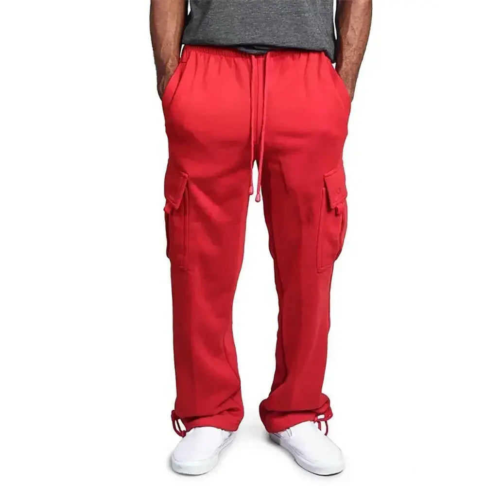 Pantalons cargo rouges pour homme à coupe ample, avec taille et bas de jambe à cordon de serrage, réalisés dans un tissu doux.
