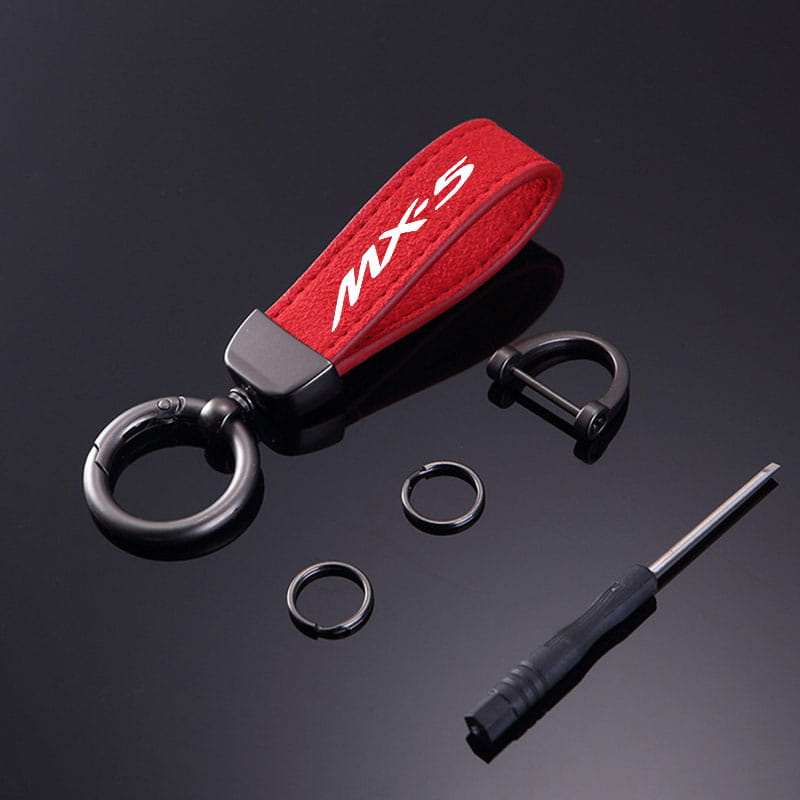 Red suede mazda mx5 leather keychain with white embroidery and black metal hardware for car key ring holder.