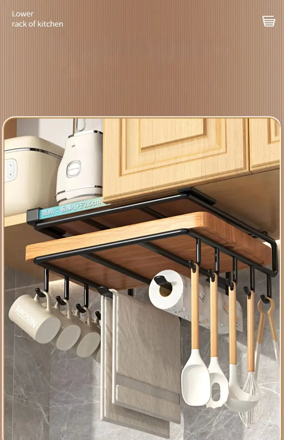 Black metal and wood kitchen under shelf basket storage rack with hanging hooks for mugs utensils and a roll of paper towels for cabinet organization.