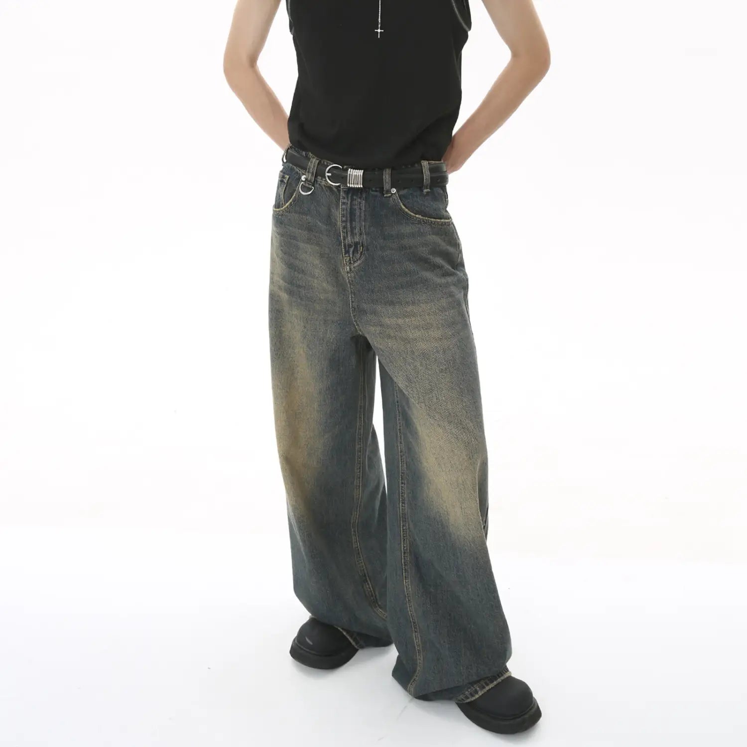 Men’s vintage wide leg baggy denim jeans in dark wash with faded distressing and a wide-leg cut.