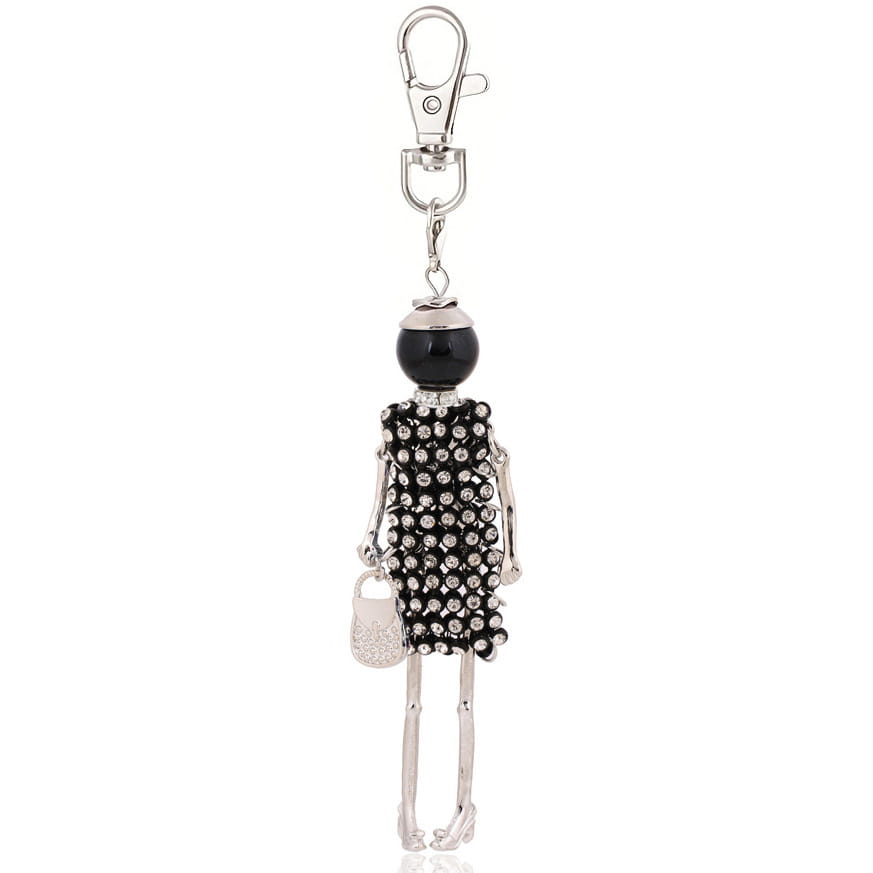 Black and silver rhinestone-encrusted skeleton figure keychain with a glossy black bead head, slender metallic limbs, and a tiny crystal-studded handbag accessory, designed as a women bag pendant.