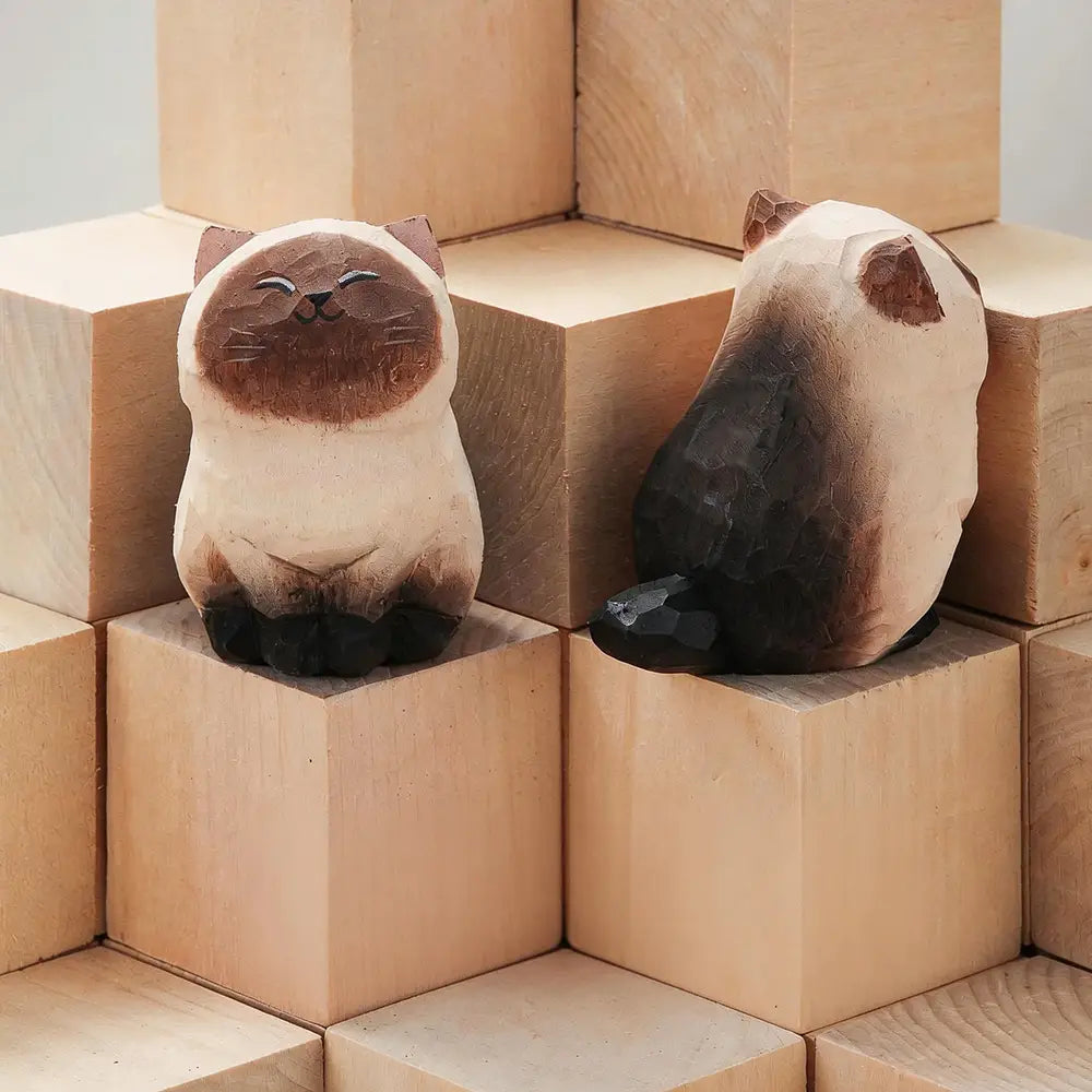 two hand carved wooden cat figurines in cream and brown tones with detailed facial expressions displayed as handcrafted wooden cat figurine desk decor for actual product factory direct sale