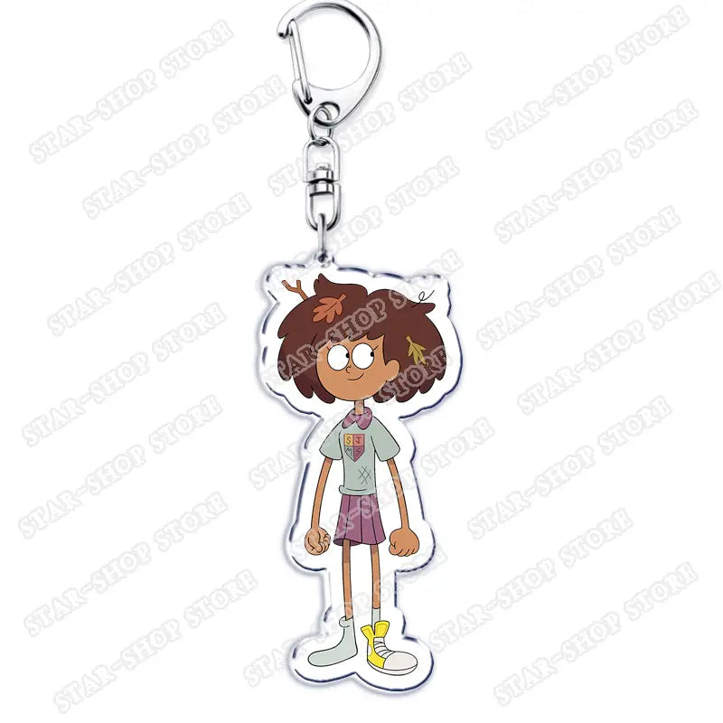 Clear acrylic Amphibia anime keychain featuring a cartoon character with brown hair wearing a light green shirt and purple skirt.