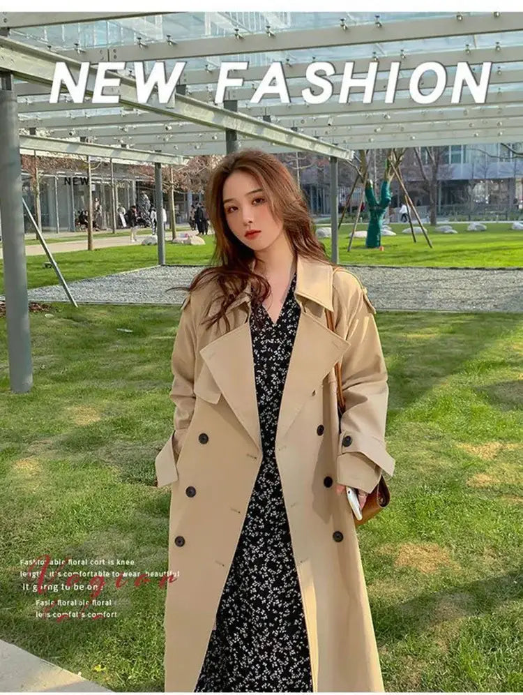 Beige women double-breasted trench coat with black buttons designed as a casual windbreaker.