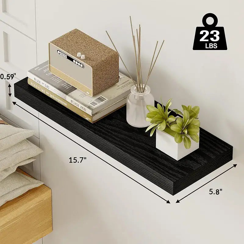 Black floating shelf with wood grain texture measuring 15.7 by 5.8 inches designed for living room wood wall display.