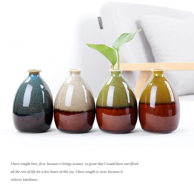 Four ceramic vases with glossy flower glaze in two-toned shades of green brown and beige for home decor.