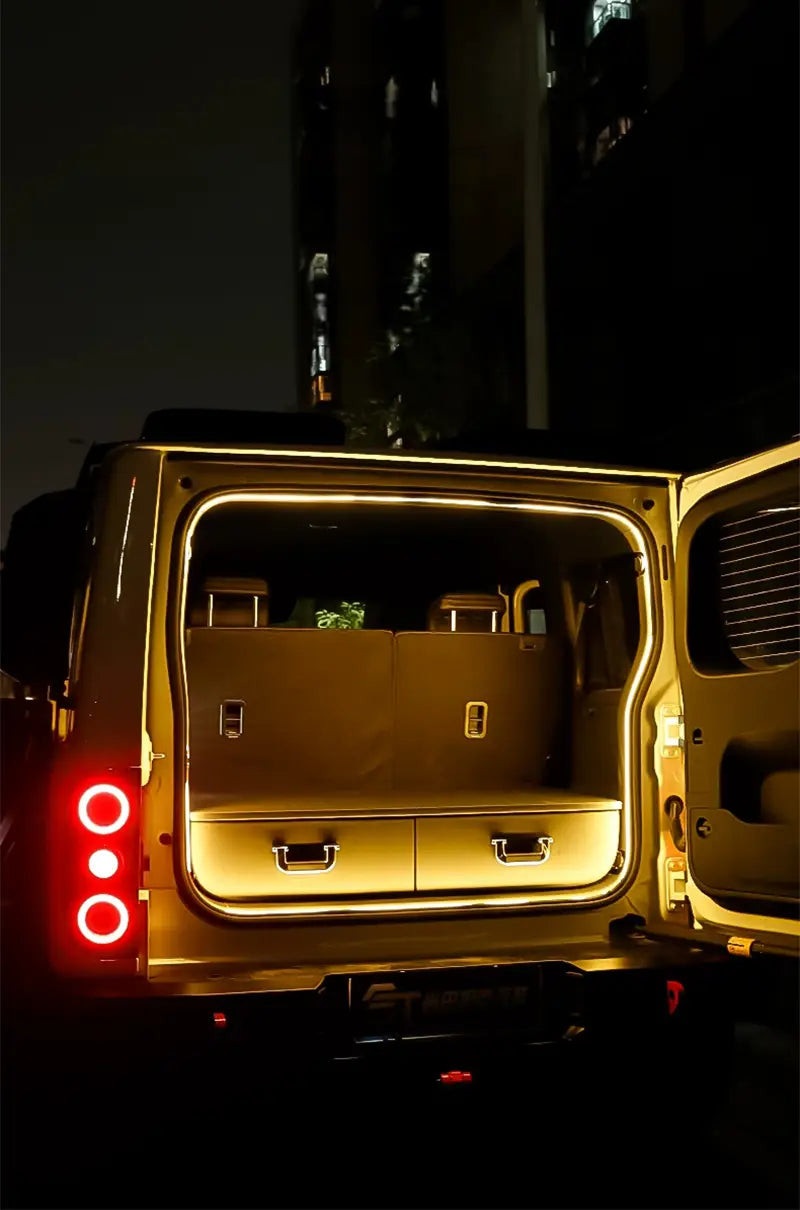 rear view of gold-colored baic 212 t01 2024 van with illuminated interior and two drawers in rear cargo area showcasing trunk lighting fit for modified auto trunk applications.
