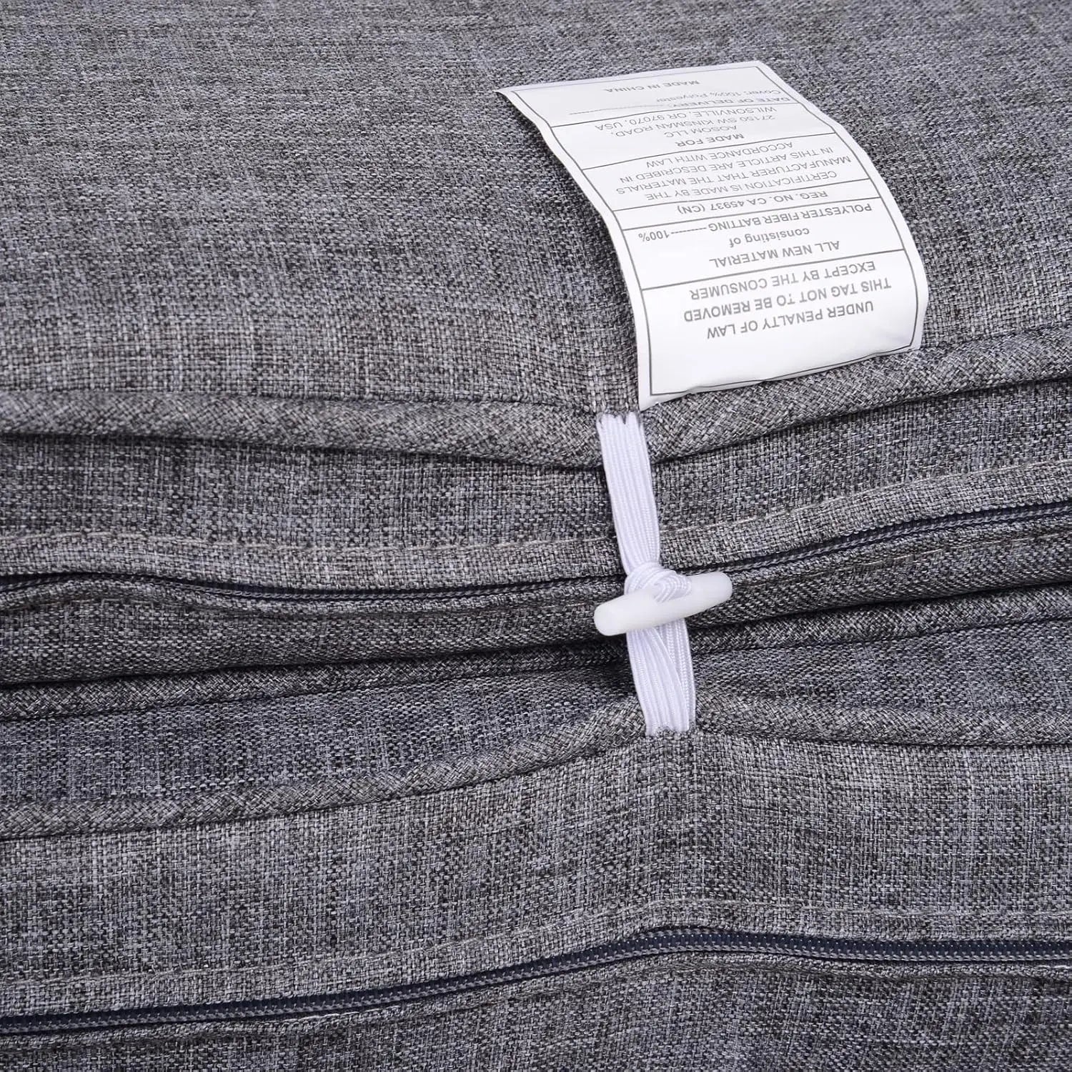 gray textured polyester fiber batting with a white label and matching drawstring closure for the patio furniture set 7 piece gray wicker sectional with coffee table