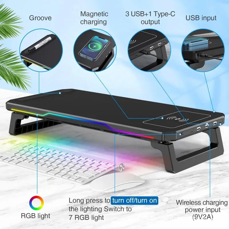 Soporte ergonómico negro para monitor de computadora con iluminación RGB, almohadilla magnética de carga inalámbrica, múltiples puertos USB e indicación del voltaje del puerto de entrada.