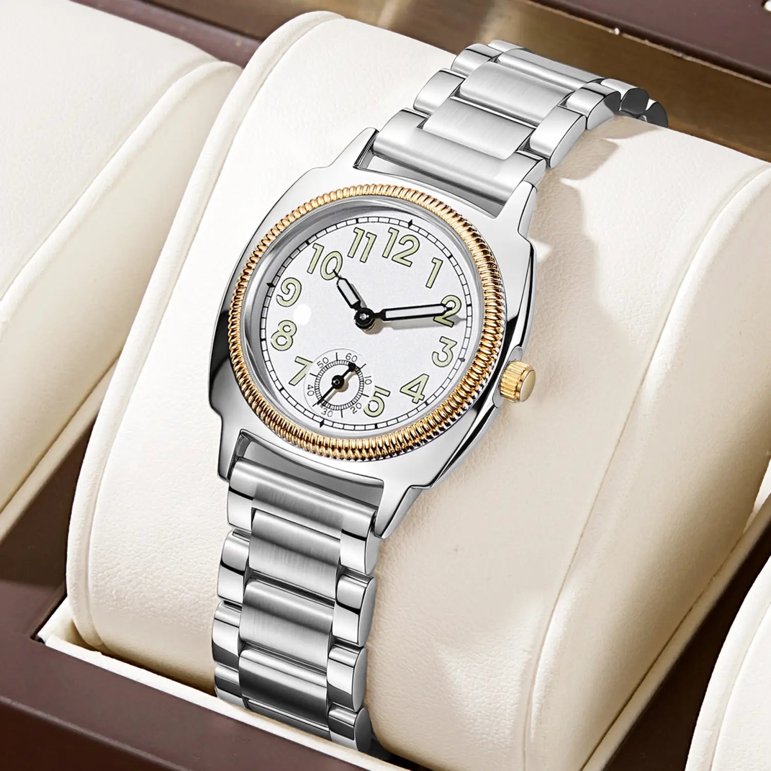 A sleek silver and gold-tone stainless steel analog wristwatch for women with a white dial black hands and arabic numerals pintime stainless steel quartz watch.