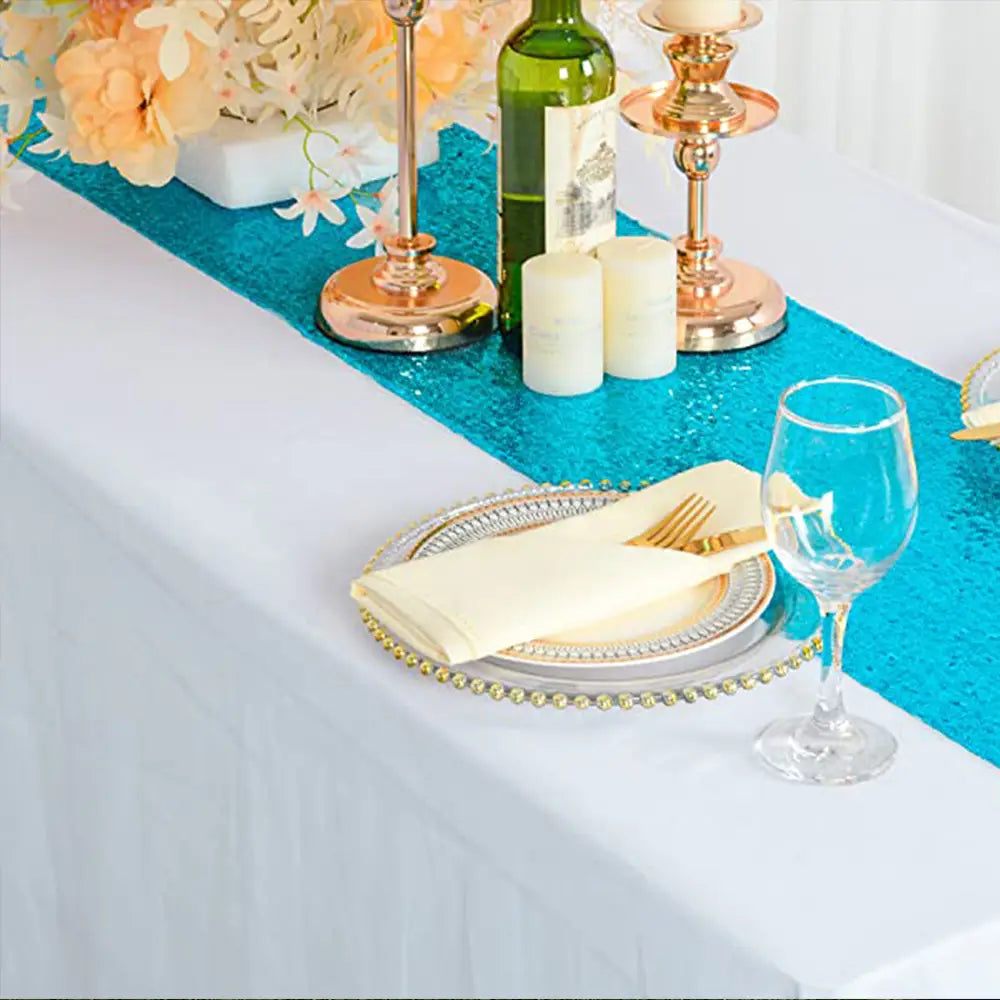 Vibrant turquoise sequin table runner 12x72 inch with a shimmering textured surface ideal for party decor.