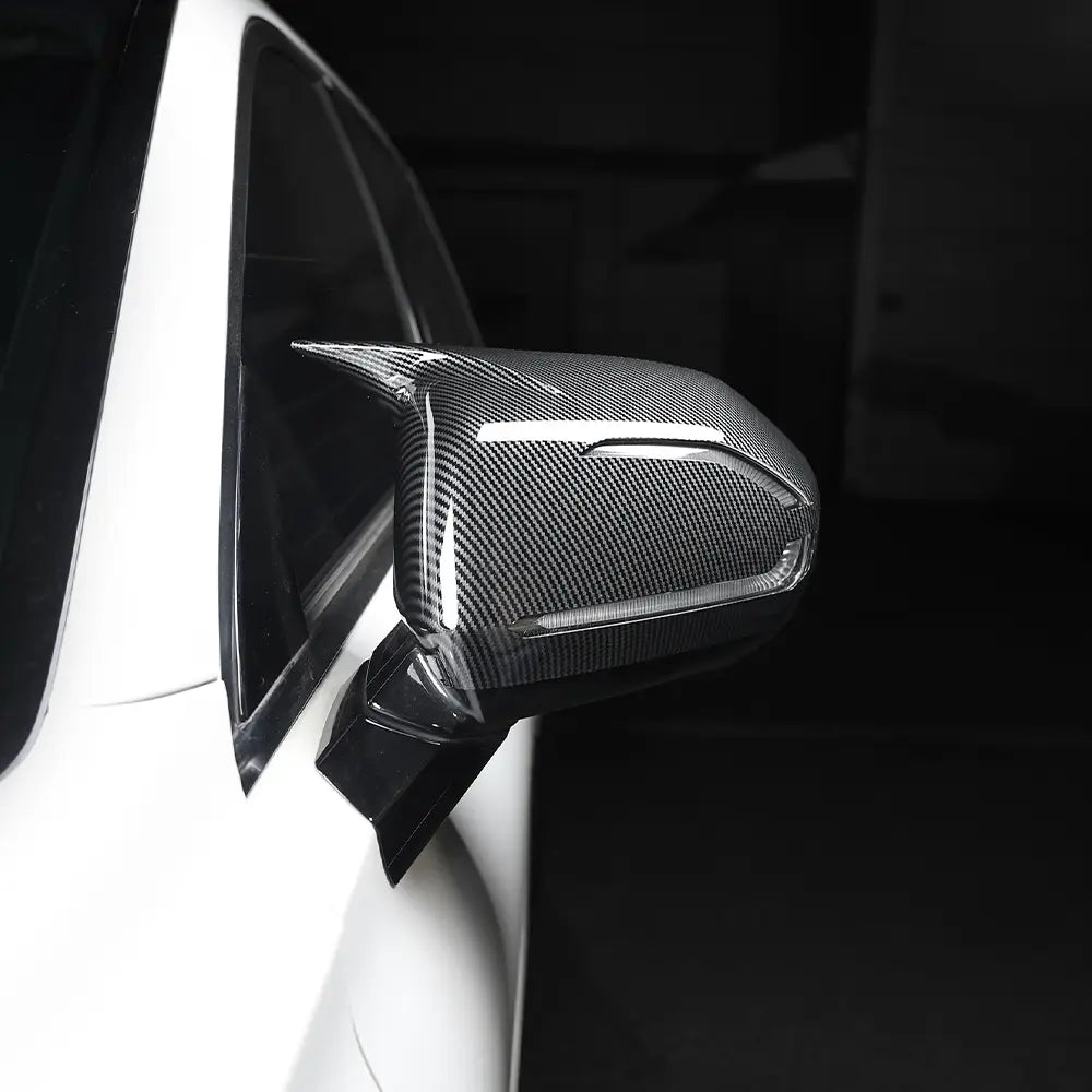 Carbon fiber Hyundai Palisade LED mirror cover with a sleek glossy finish and precise contours designed for 2020-2025 models.