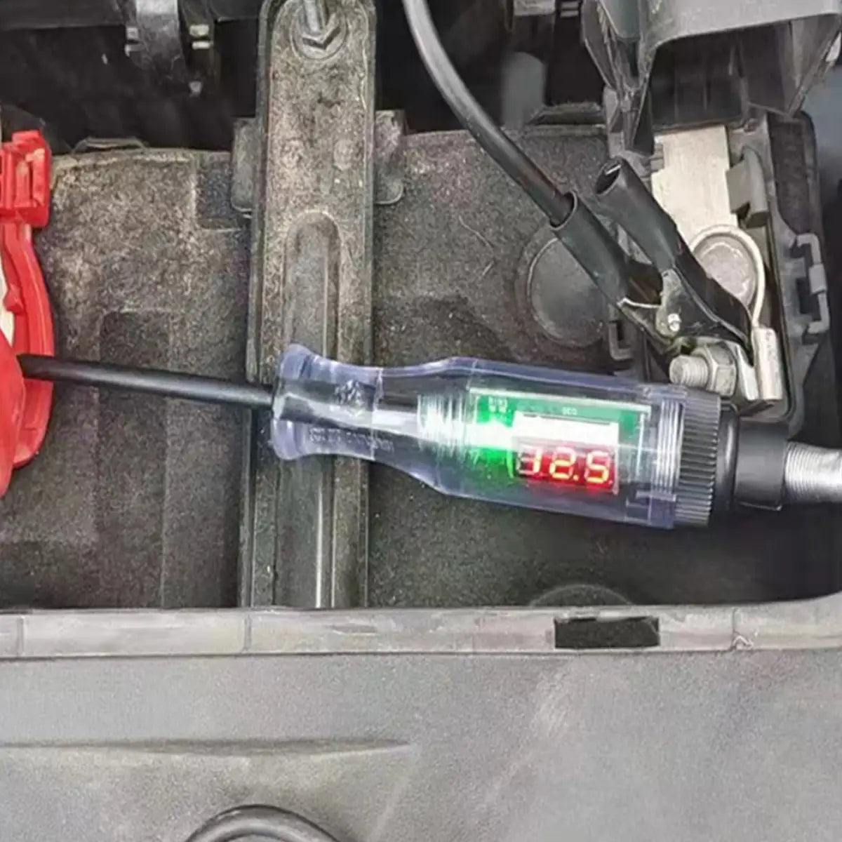 Automotive digital voltage circuit tester pen featuring a transparent plastic case digital multimeter with a red LED display showing 32.5 and a black probe.