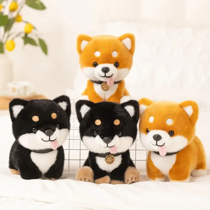 Adorable plush Shiba Inu dog stuffed animal toys in black and orange with white accents each wearing a small gold-colored tag on their collar.