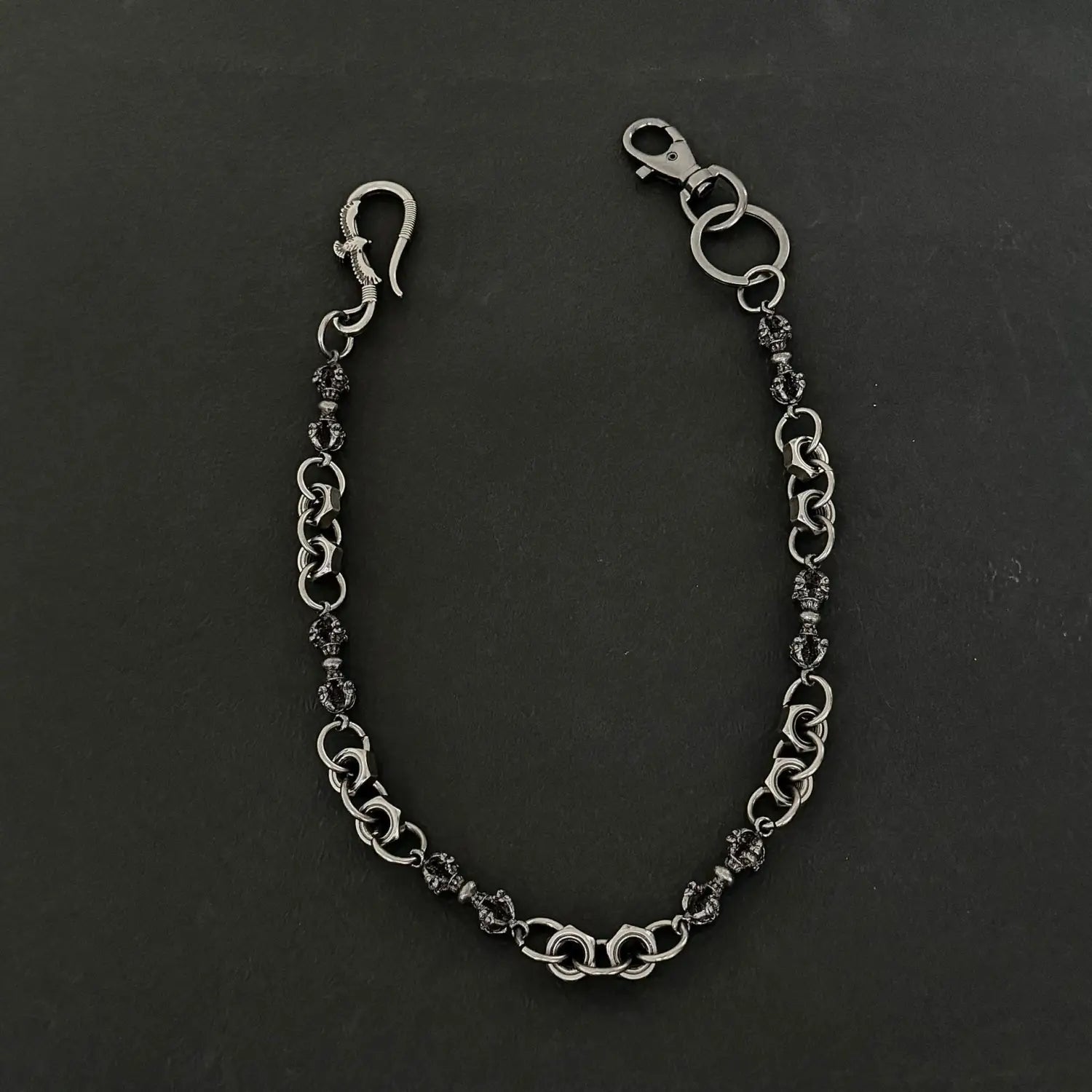 Men Eagle Punk trouser chain wallet accessory featuring a silver-toned heavy metal belt loop with ornate skull charms and a sturdy clasp.