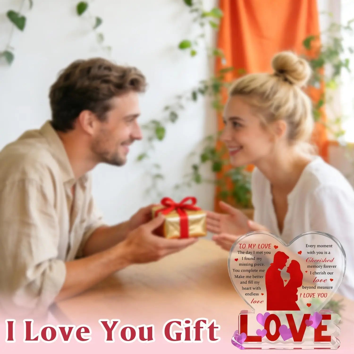 A gold acrylic heart keepsake gift box tied with a red ribbon for a romantic valentine occasion.