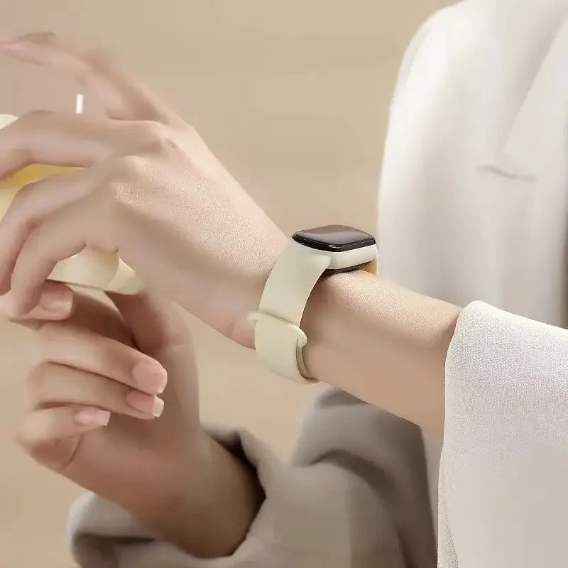 Cream-colored silicone bracelet wrist with a sleek minimalist design worn as a Xiaomi Mi Band wristband silicone bracelet.