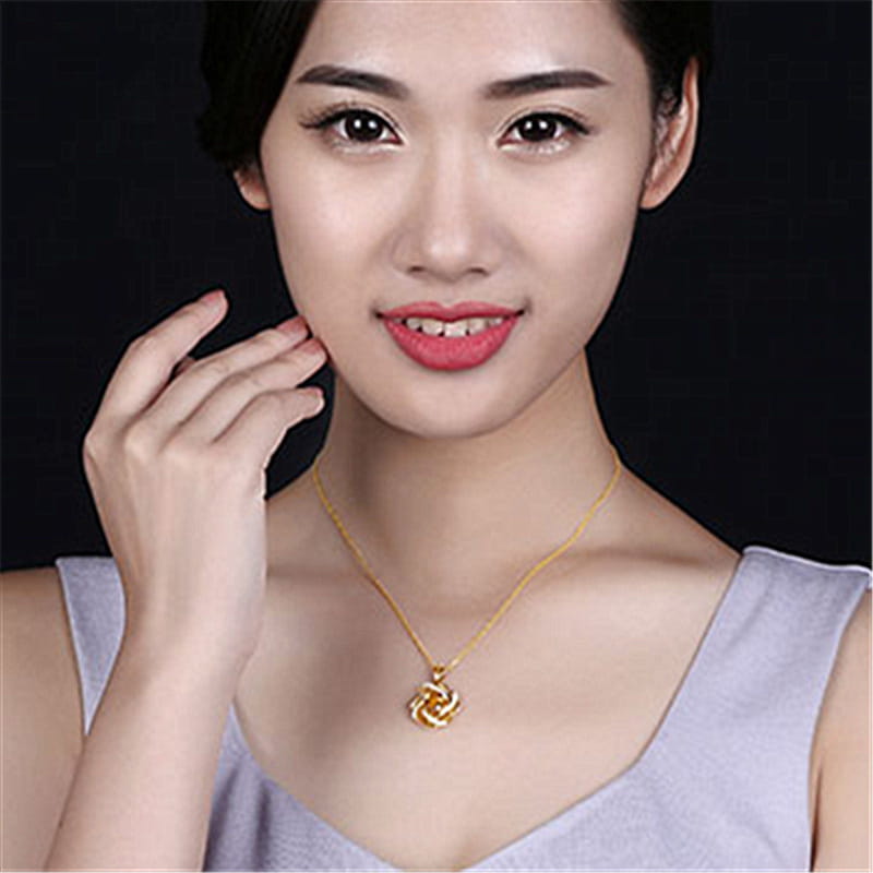 Collier pendentif en forme de nœud doré avec une chaîne délicate en or, présentant un design de pierre de naissance moulin à vent en citrine.