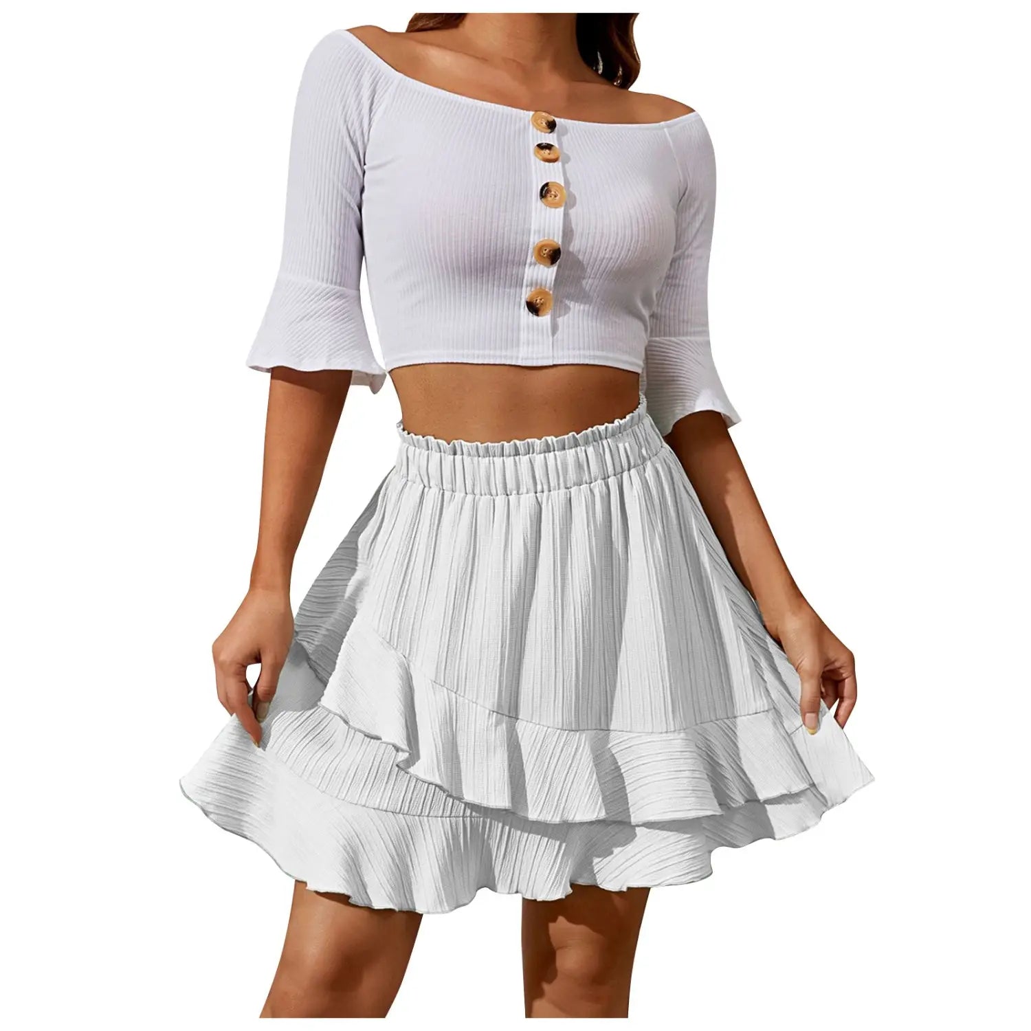 white ribbed off-the-shoulder crop top with three-quarter sleeves and wooden buttons down the front paired with a high waist ruffle mini skirt