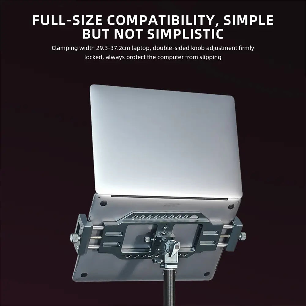 Silver aluminum vertical laptop stand with adjustable clamp and sturdy metal construction designed for tripods.