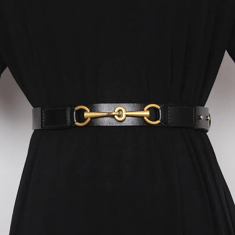 Black leather belt for women featuring a gold-tone horsebit buckle.