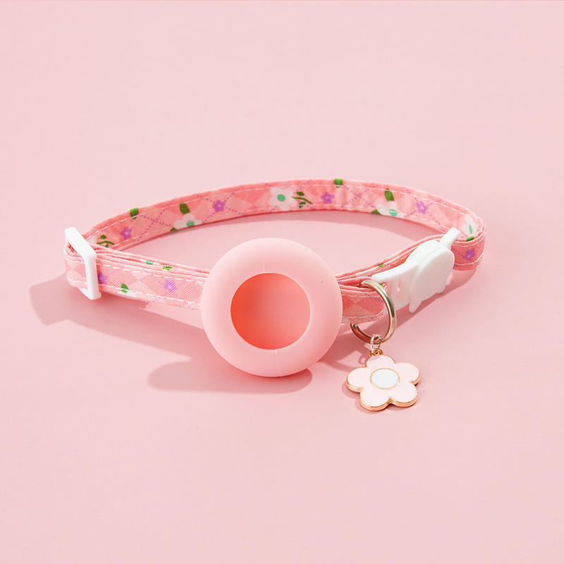 pink floral-patterned airtag cat collar with a soft silicone ring and white enamel flower charm featuring an airtag protective case for outdoor park dog and park dog cat use
