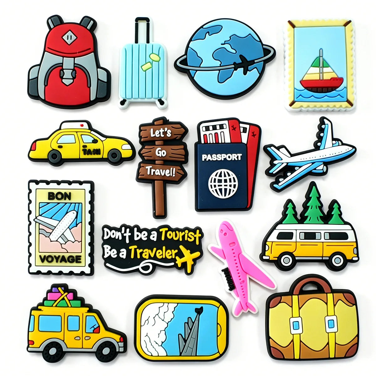 A collection of colorful rubber travel shoe charms pvc clog decorations featuring backpacks suitcases airplanes and passport designs in red blue yellow pink and brown.