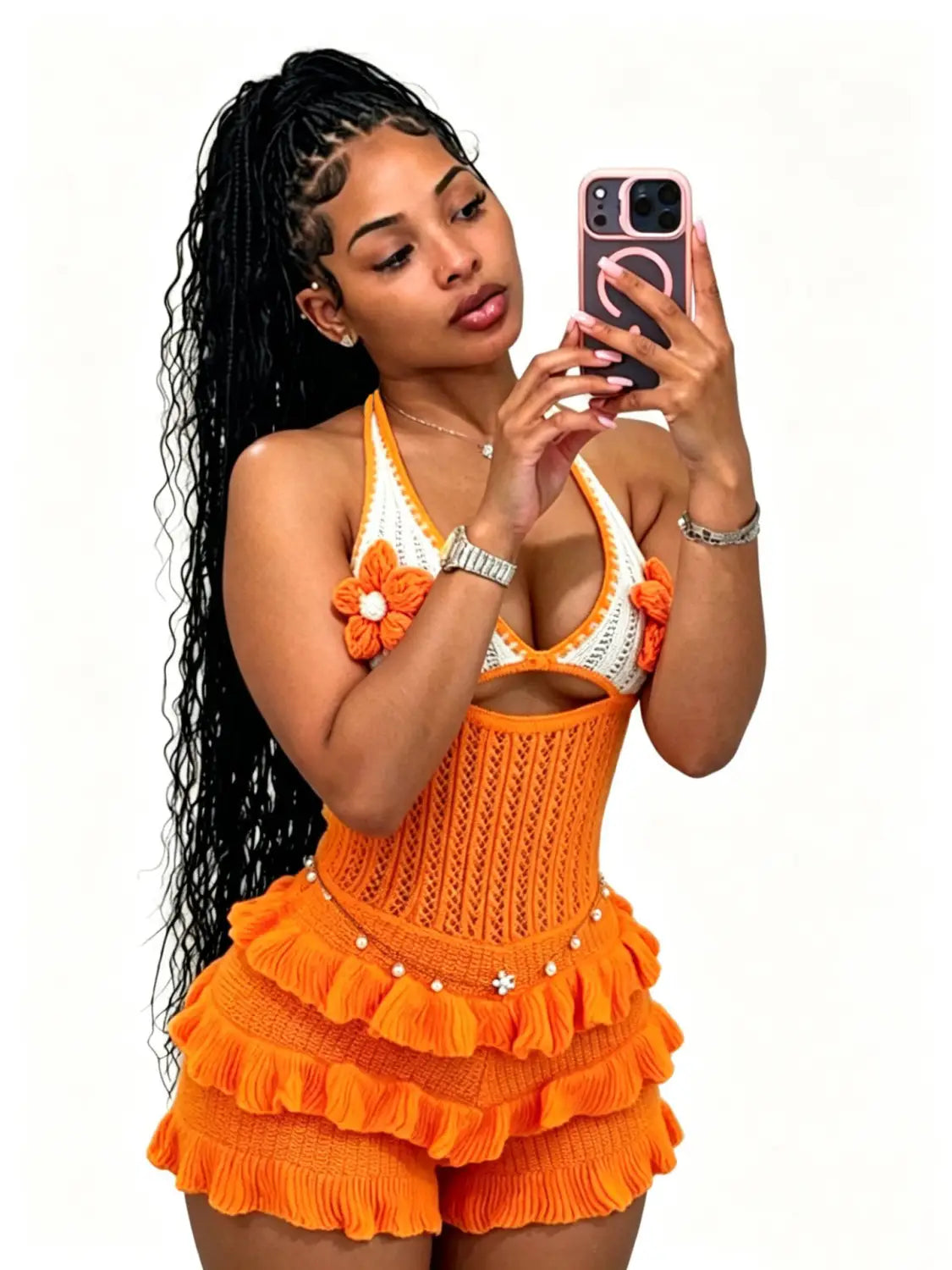 Orange knitted ruffle halter romper with white floral embellishments and pearl trim ideal for summer playsuit wear.