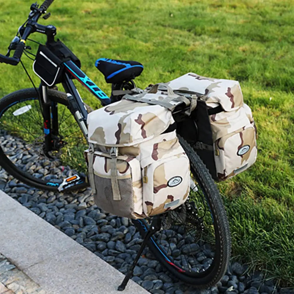 Beige-braune Tarnmuster-Ztz 50l wasserfeste Doppelfahrradtasche mit Mesh-Seitentaschen und rundem Logo-Patch.