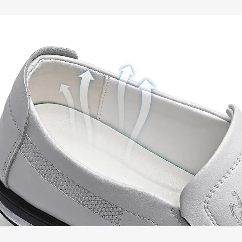 Men leather slip on driving shoe in white leather with a textured mesh panel on the side and black rubber sole designed for casual wear.