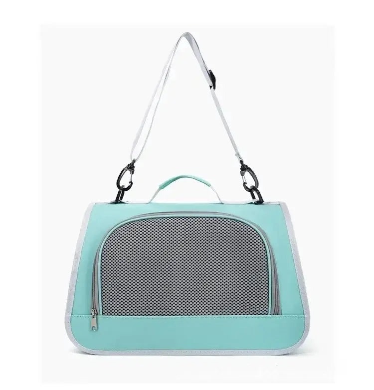 Sac bandoulière de transport pour animaux en maille respirante vert menthe, avec panneau avant en maille grise et bordure blanche, conçu pour un transport confortable de l’animal.
