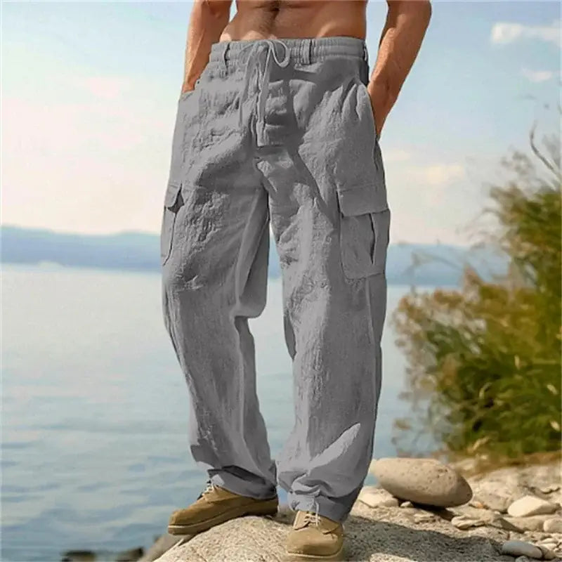 pantalons cargo en lin pour hommes décontractés et amples, en gris clair, avec plusieurs poches et une ceinture à cordon de serrage, fabriquée à partir d’un tissu en lin respirant