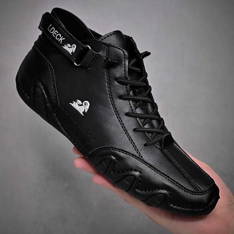 Men high top leather casual sneaker in black featuring a white ram logo and ldeck branding on the strap.