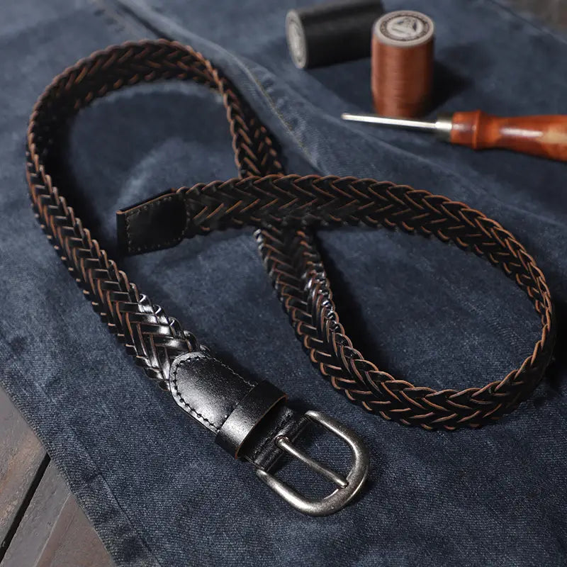 A unisex casual braided brown leather belt with a silver-toned buckle and black leather tab.