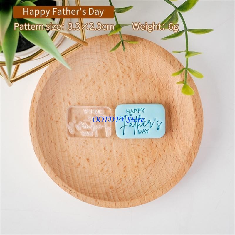 Light blue rectangular silicone fathers day cookie cutter and fondant stamp with happy fathers day engraved in cursive script.