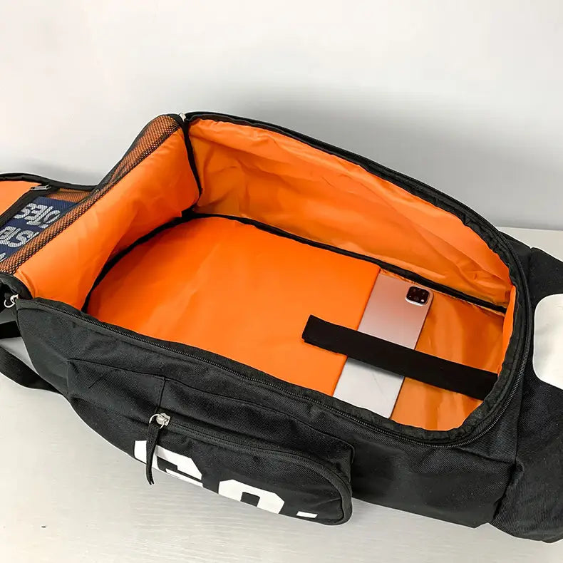 black and orange waterproof gym backpack and travel duffel bag with a bold white logo on the side