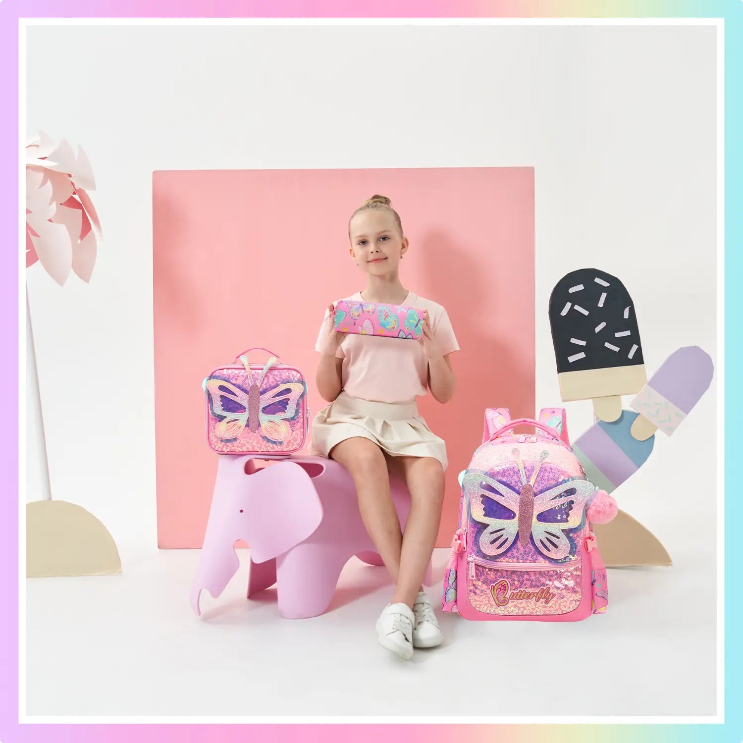 Schulrucksack-Set für Meerjungfrauen-Mädchen im Stil von rosa Schmetterlingen mit Lunchbox, mit glitzerndem Paillettenbesatz und einem Schmetterlingslogo auf der Vorderseite.