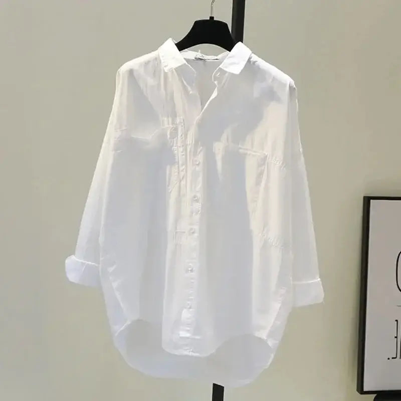 a crisp white long-sleeved button-up office blouse for women with a relaxed fit and rolled cuffs measuring approximately 24 inch 61 cm in sleeve length