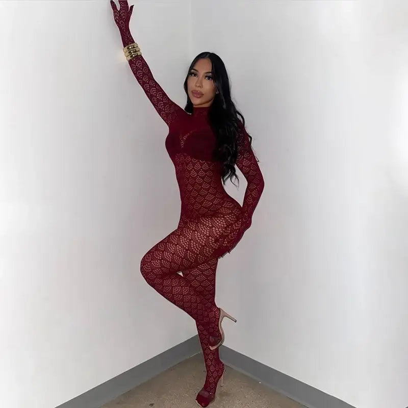 A form-fitting deep red lace fishnet see through long romper with a high neckline and long sleeves.