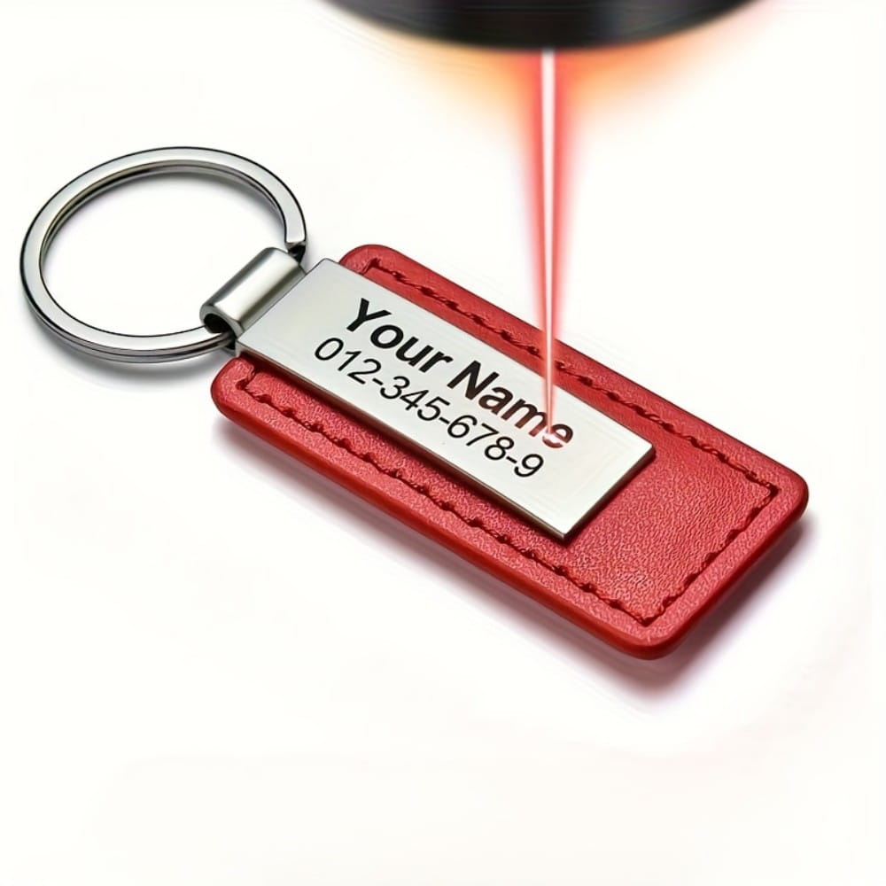 Red leather customized keychain with an engraved silver stainless steel id tag featuring a name and phone number.