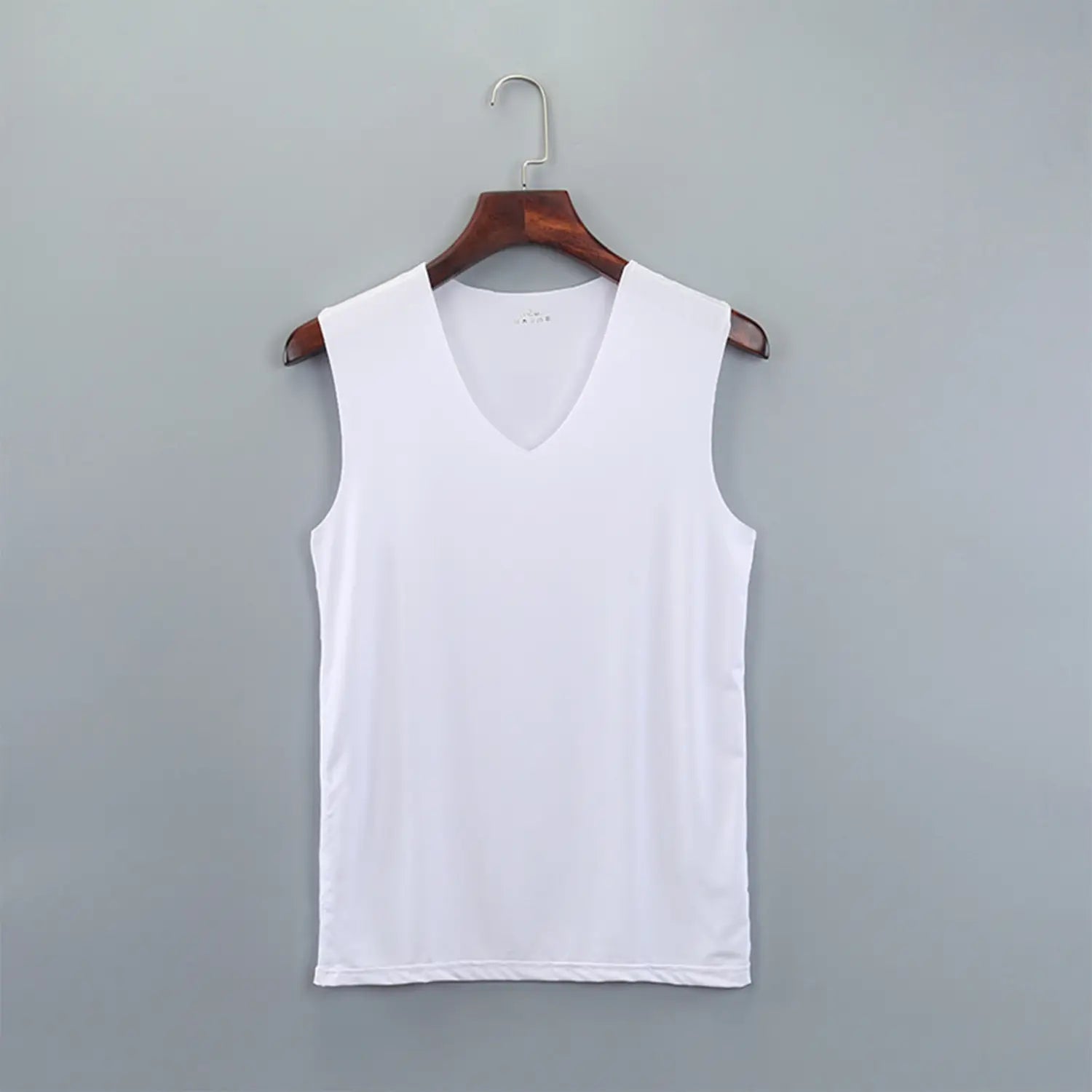 white sleeveless v-neck men ice silk tank top hanging on a wooden hanger