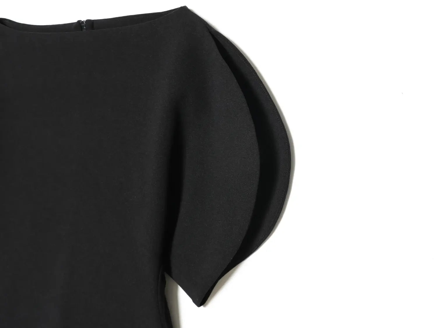 black dress with a sleek minimalist design featuring soft flowing puff sleeves showcasing elegant sleeve style for casual and formal occasions