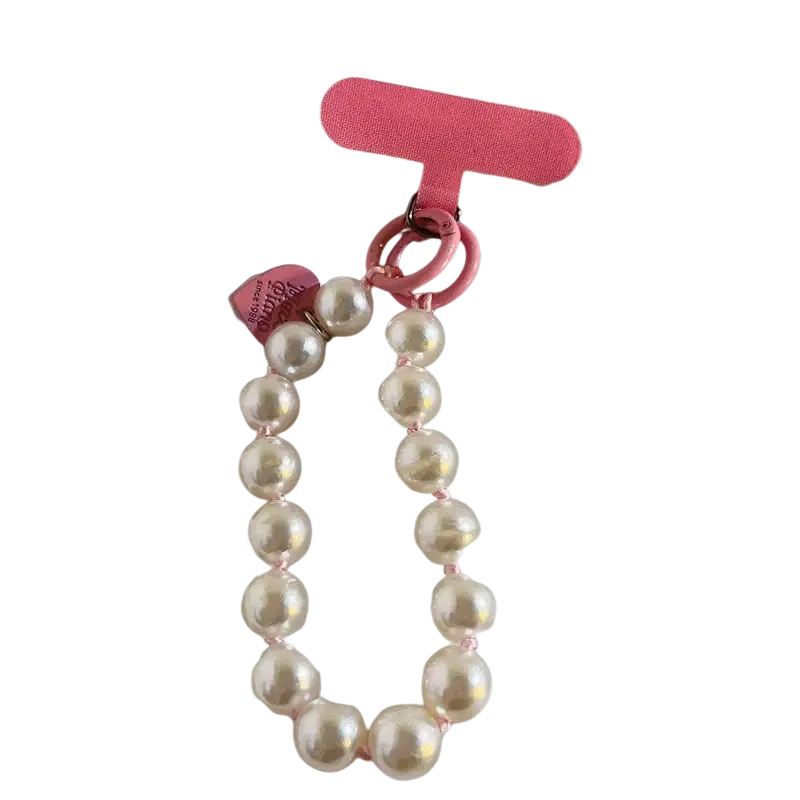 Beaded phone wrist strap in pink pearl with matching t-shaped clip and heart charm shown from front angle