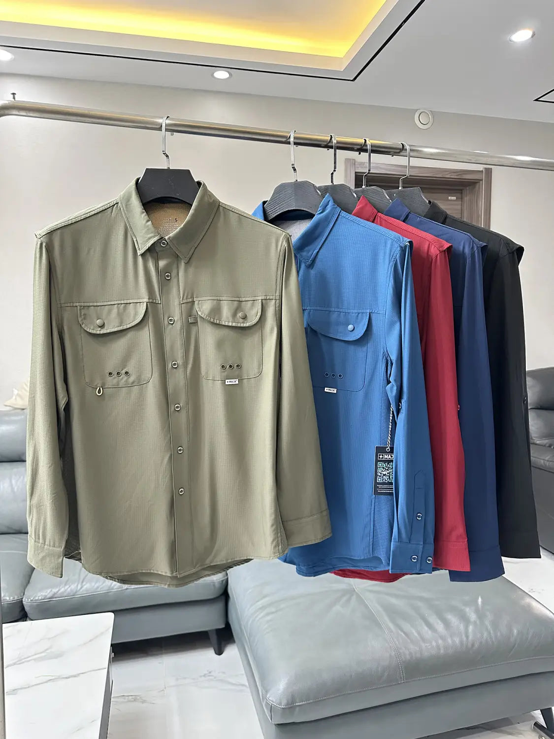 Men’s tactical outdoor long sleeve shirt in olive green featuring two chest pockets with metallic rivets for durability and utility.