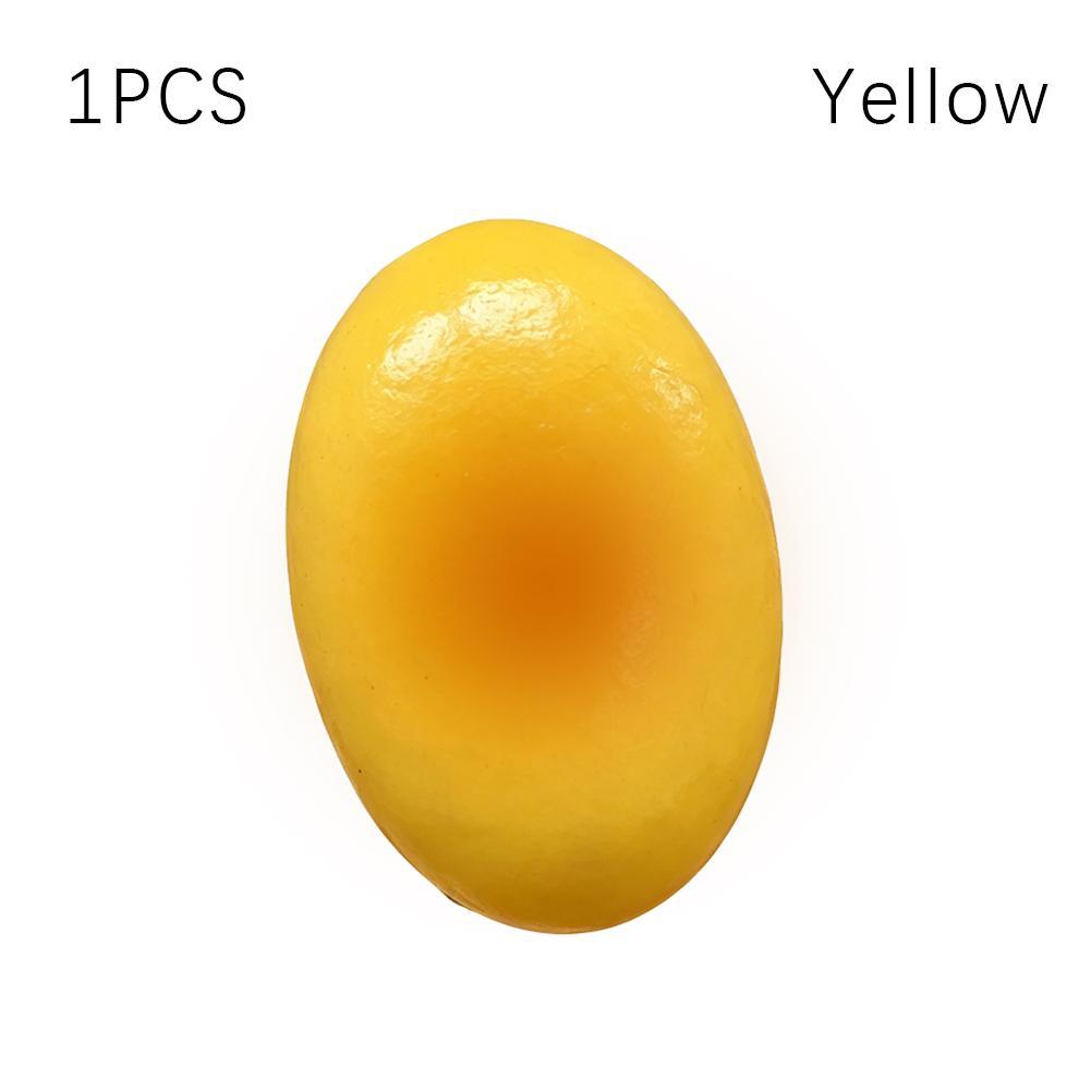Un pastel de queso esponjoso y blando de color amarillo liso, ovalado y suave, lento en elevarse, con acabado brillante, diseñado para aliviar el estrés.