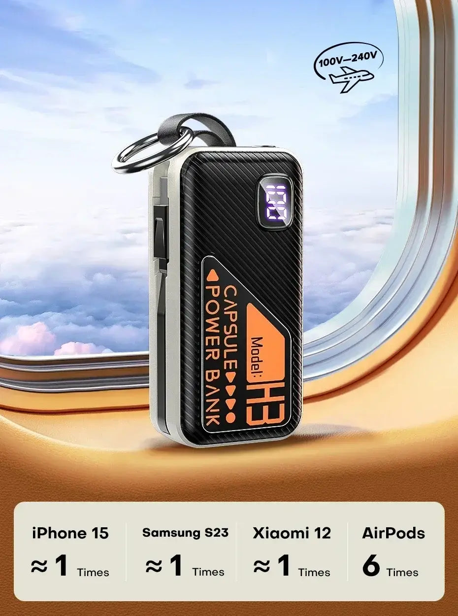 Black carbon-fiber textured portable power bank with silver edges and orange branding featuring a digital display showing 35 percent battery for fast charging.