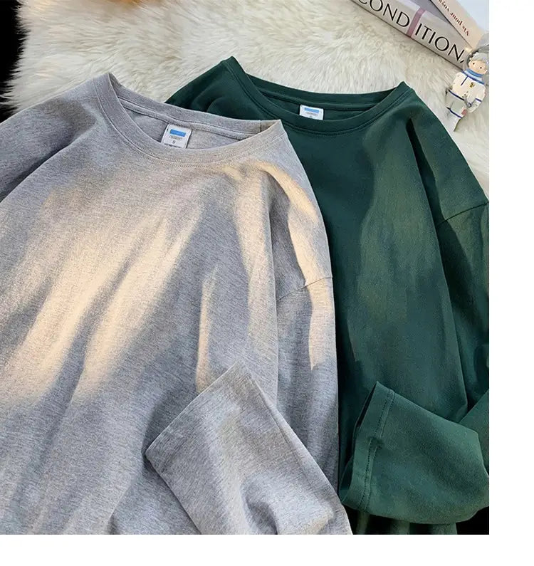 Gray and dark green oversized long sleeve blank t-shirts made of soft cotton blend fabric with crew neck design.